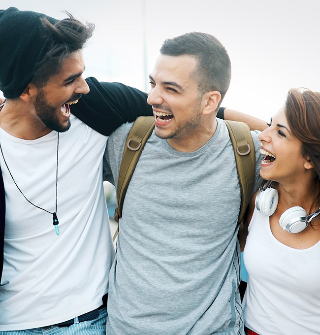 Chaska dental crowns patient smiling with friends