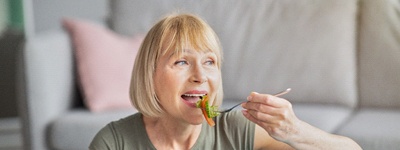 older couple brushing teeth together