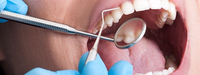 older couple brushing teeth together