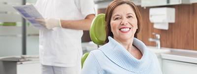 a patient with dental implants smiling