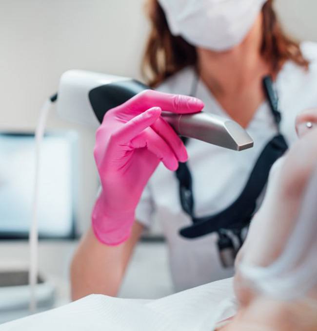 a dentist using an iTero scanner
