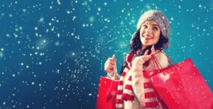Smiling woman doing holiday shopping
