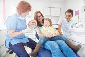 mother and young daughter visiting their family dentist 