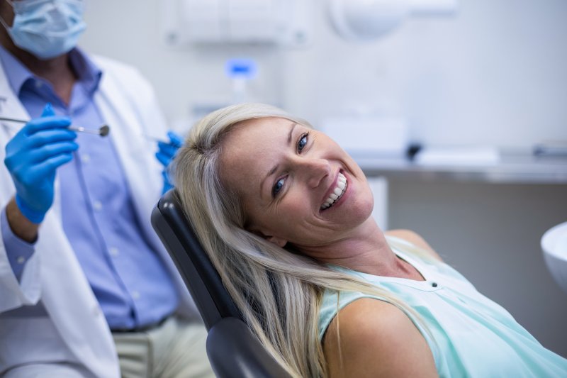 Woman smiling at routine dentist's appointment