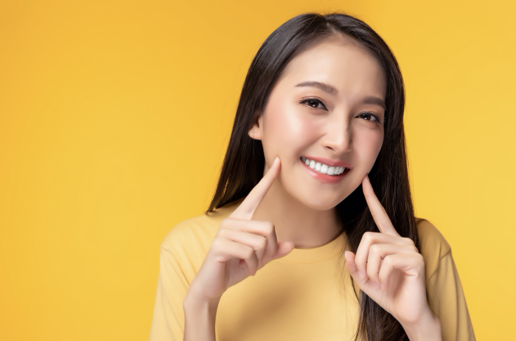Chaska woman pointing at smile