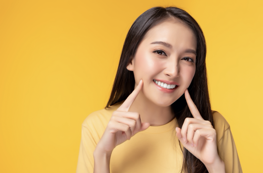 Chaska woman pointing at smile 