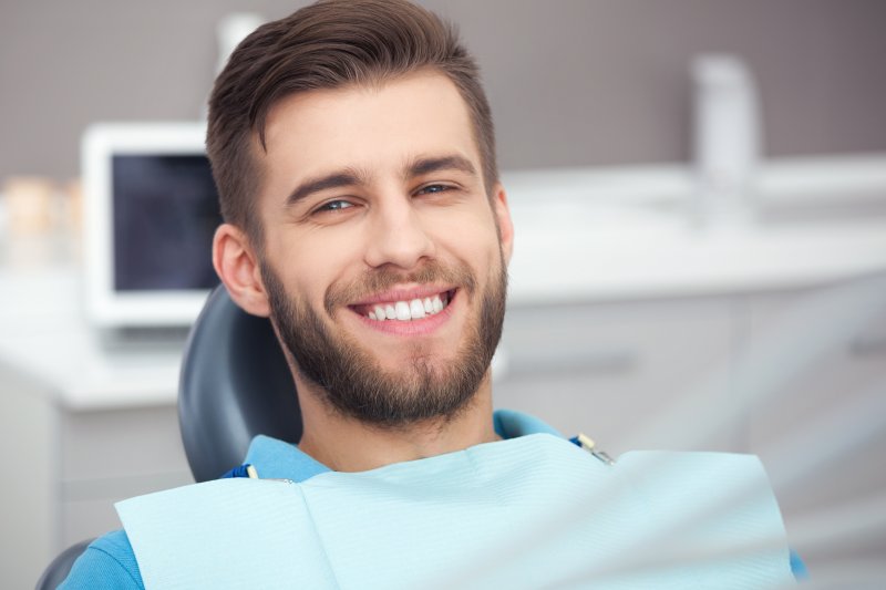 A man smiling at their dentist in Chaska