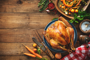 Thanksgiving food set out on a wooden table