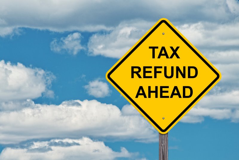 sign that reads “tax refund ahead”