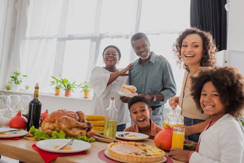 A family enjoying Thanksgiving with good oral health